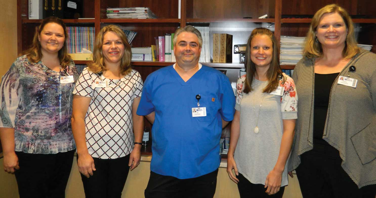 5 BSA employees in an office