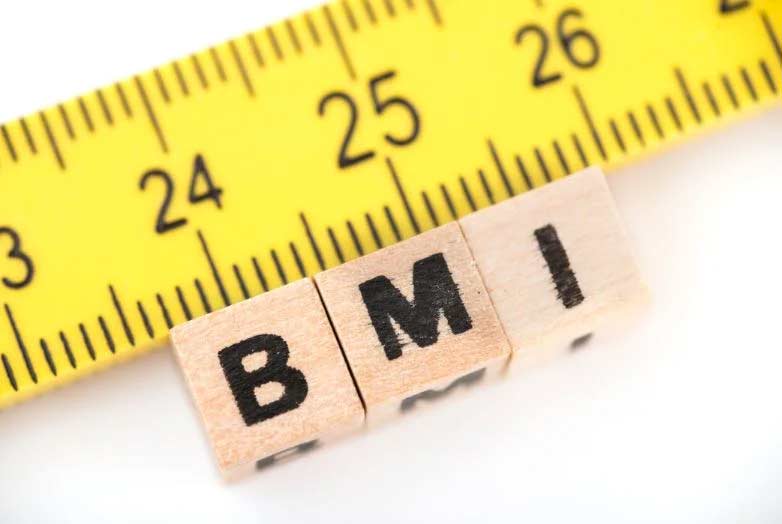 bmi letters next to yellow tape measure