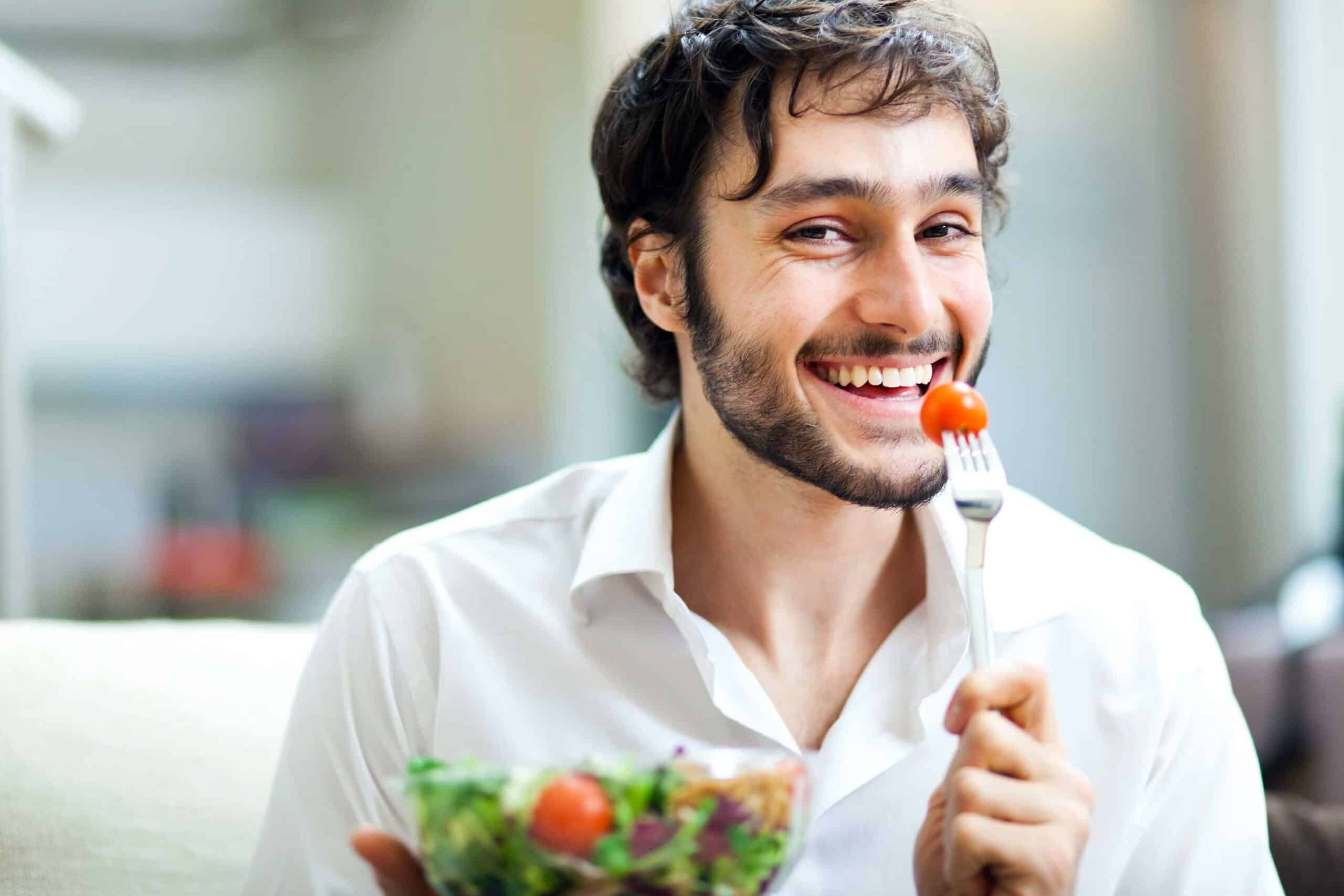 man eating fruit