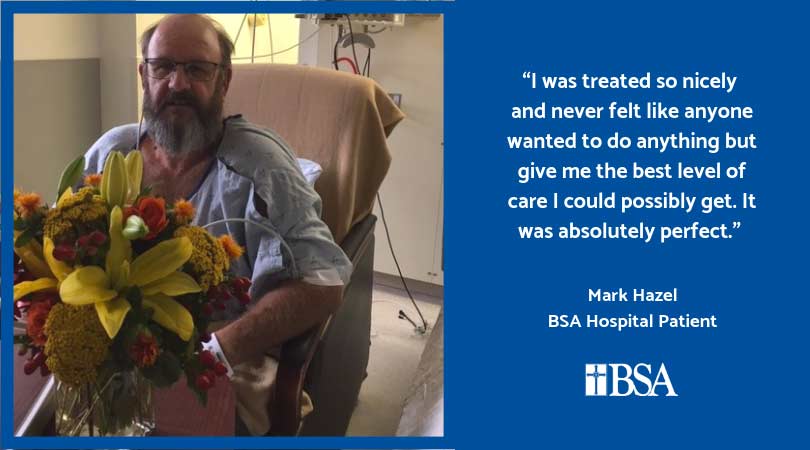 man in hospital with flowers