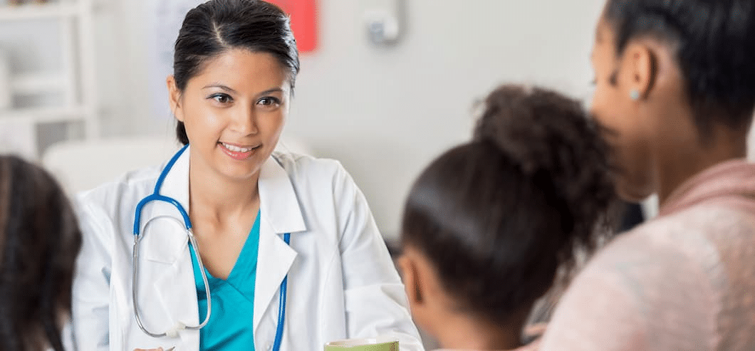 doctor speaking to a family